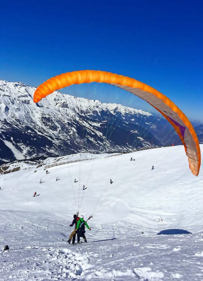 paraglider with instructor over the ski slopes 2023 03 30 16 02 44 utc