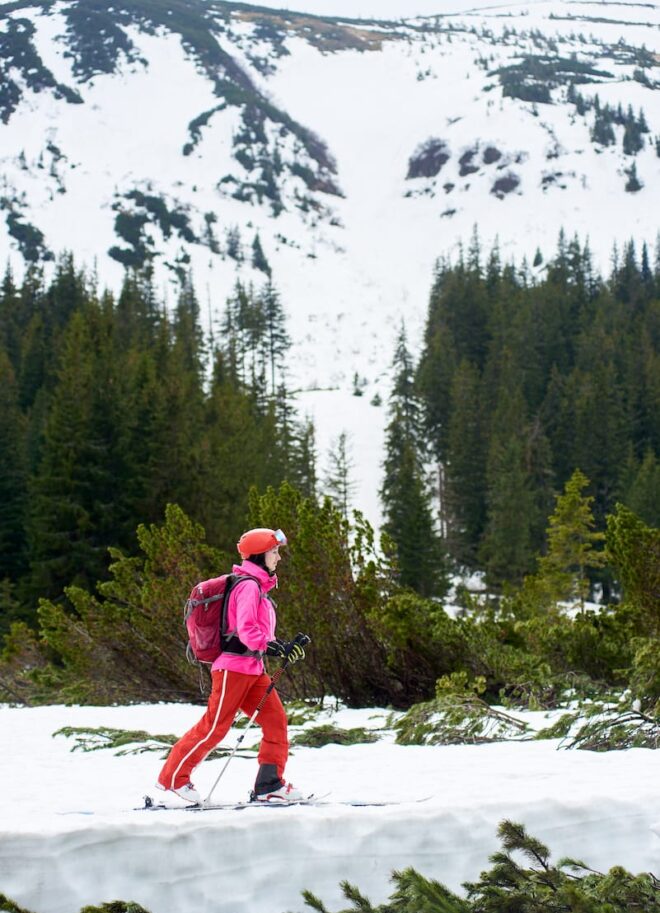 young female backpacker skier in pink suit ski tou 2022 05 17 05 27 10 utc